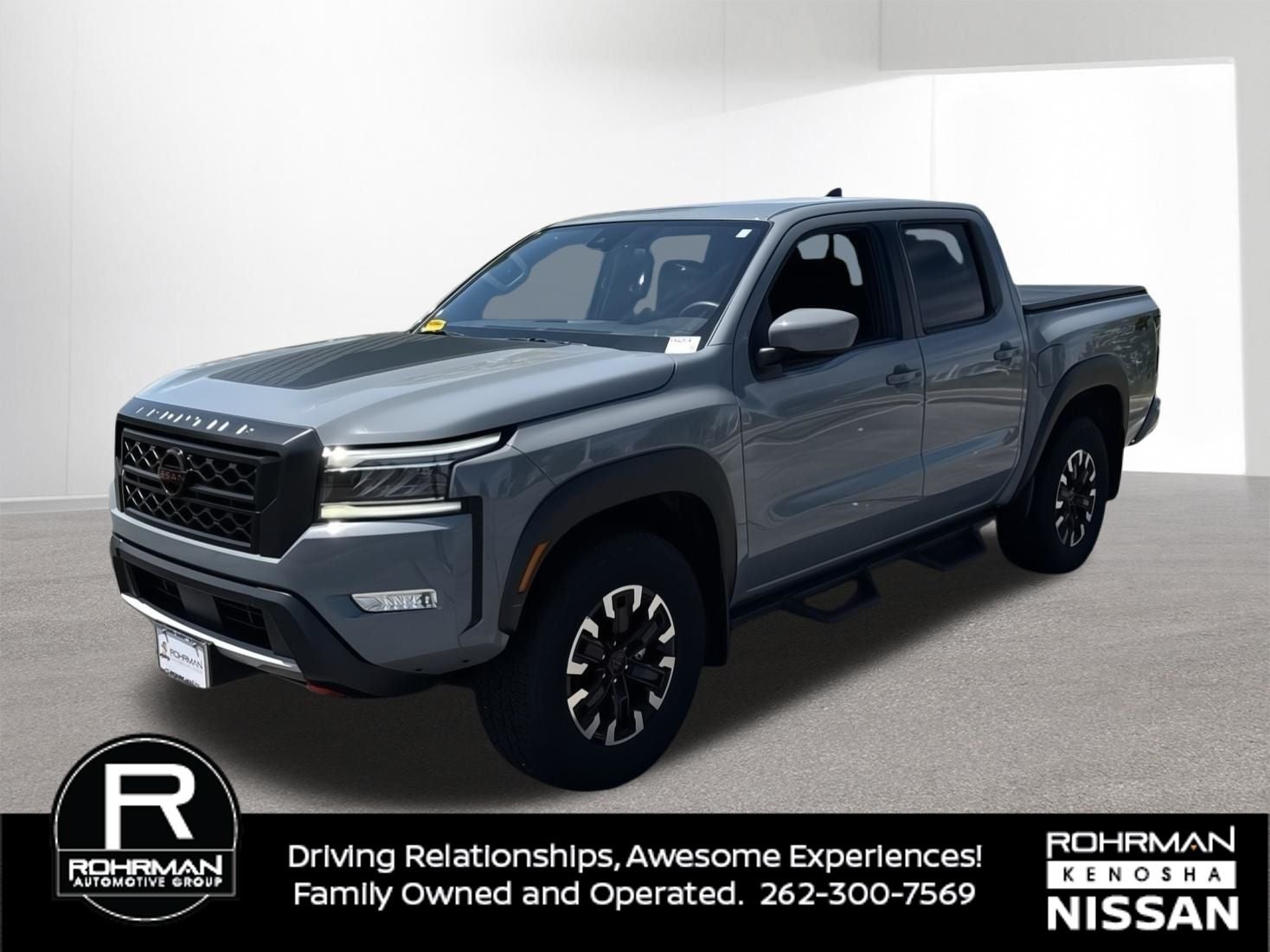 2023 Nissan Frontier PRO-4X in Boulder Gray Pearl — front three-quarter view