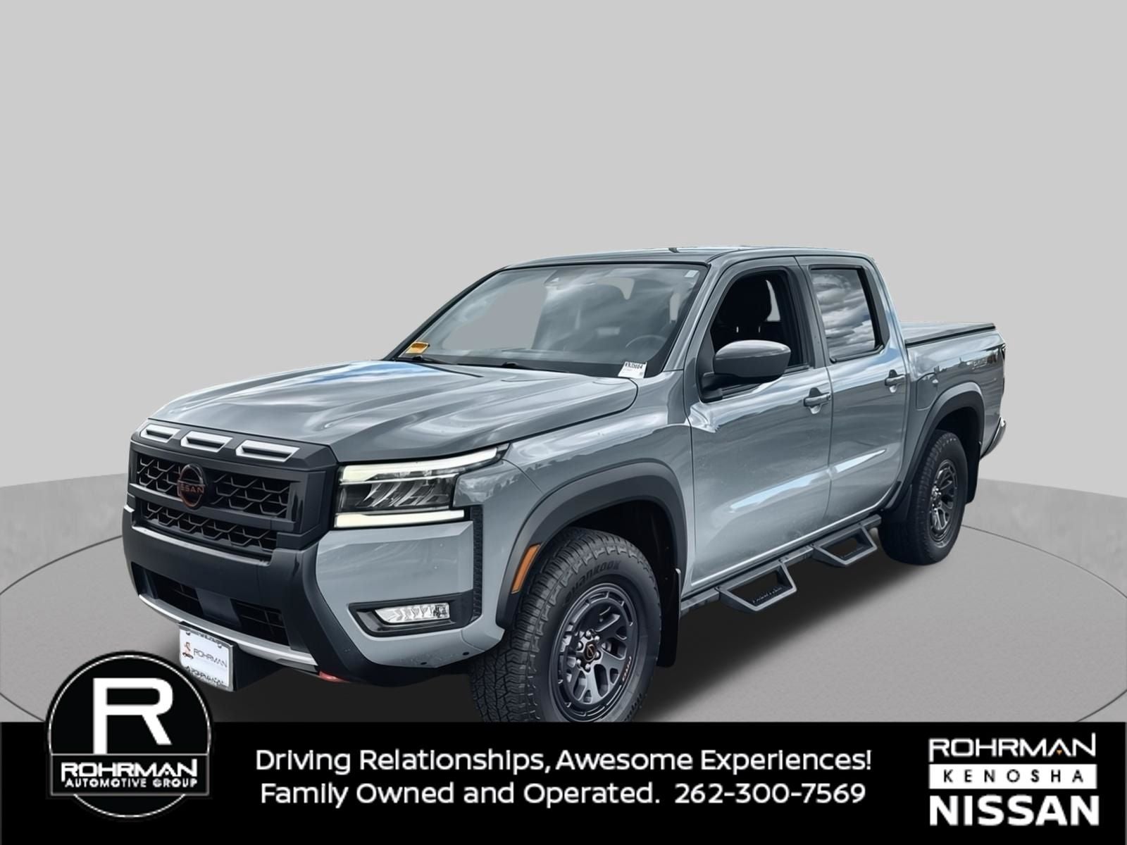 2025 Nissan Frontier PRO-4X in Boulder Gray Pearl — front three-quarter view