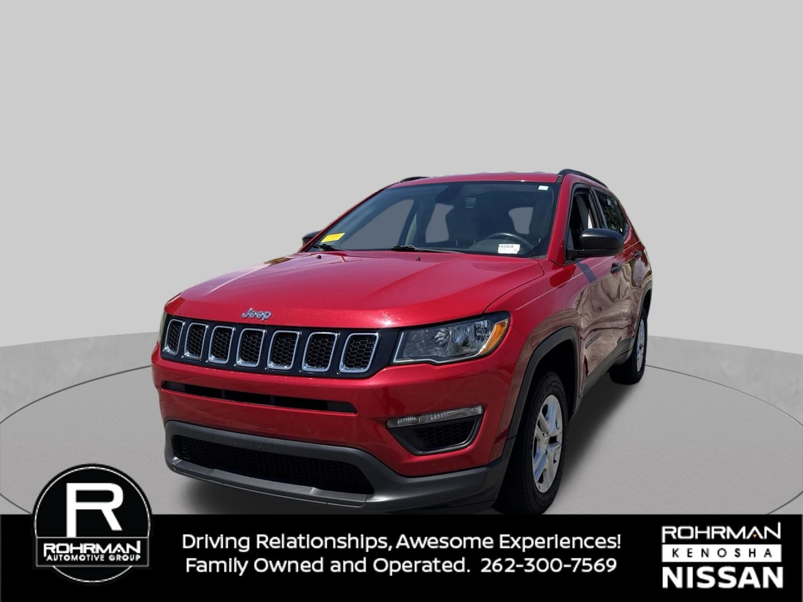 2018 Jeep Compass Sport in Redline Pearlcoat — front three-quarter view