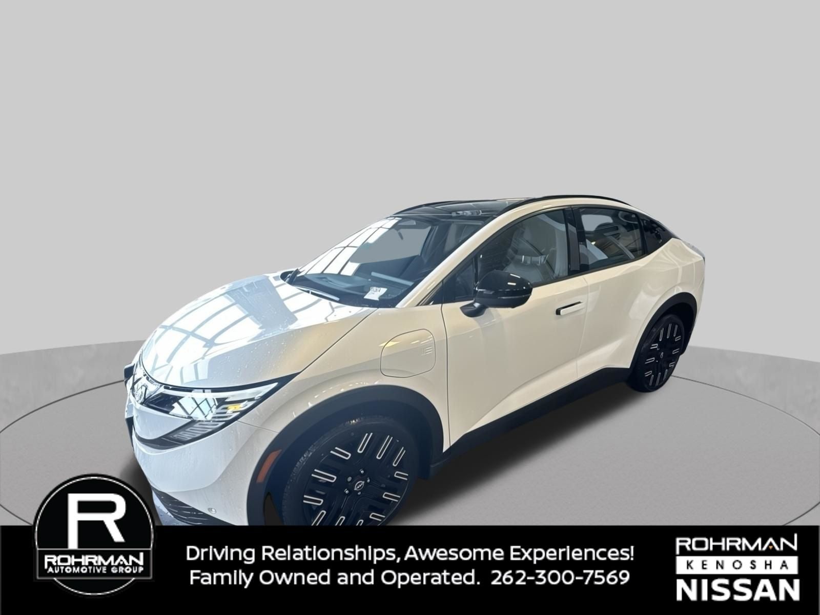 2026 Nissan Leaf PLATINUM+ in Everest White Pearl Tricoat — front three-quarter view