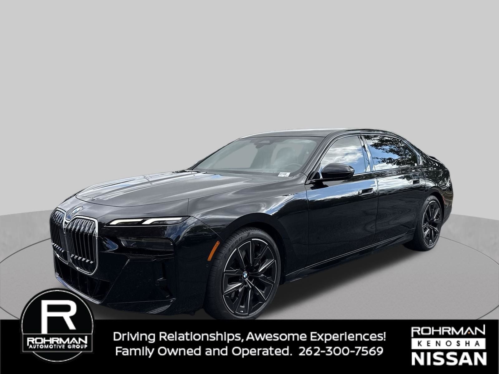 2024 BMW 7 Series 760i xDrive Premium Package M Aero in Black Sapphire Metallic — front three-quarter view